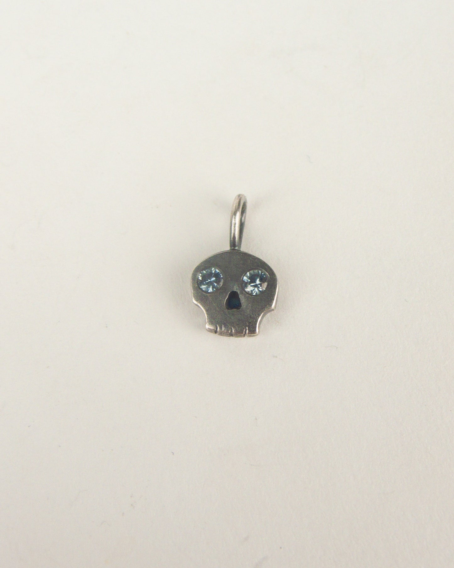 Skull Charm with Sapphire Eyes