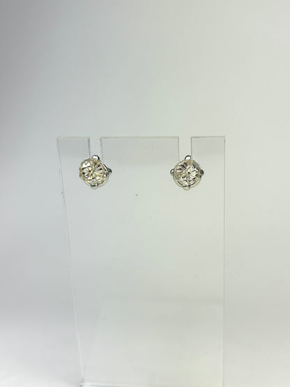 Back view of sterling silver earrings showing the earring backs. They are displayed on a clear acrylic jewelry display in front of a white background.
